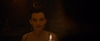 Movie still from “Eiffel” (2021), directed by Martin Bourboulon – A beautiful woman with a candle in a dark room; Close Up shot, Over the shoulder angle