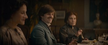 Movie still from “Eiffel” (2021), directed by Martin Bourboulon – A man and a woman sitting in front of each other; Medium shot, Over the shoulder angle