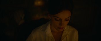 Movie still from “Eiffel” (2021), directed by Martin Bourboulon – A woman in a white shirt is looking down; Close Up shot, Low angle