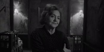 Movie still from “El Conde” (2023), directed by Pablo Larraín – An older woman sitting in front of a mirror; Close Up shot, Over the shoulder angle