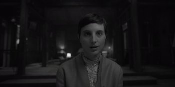 Movie still from “El Conde” (2023), directed by Pablo Larraín – A black - and - white photo of a woman with short dark hair; Close Up shot, High angle