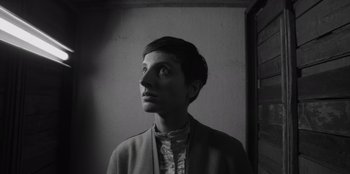 Movie still from “El Conde” (2023), directed by Pablo Larraín – A black - and - white photo of a woman looking up; Close Up shot, Low angle