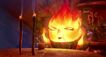 Movie still from “Elemental” (2023), directed by Peter Sohn – An image of a candle burning in front of a fire; Medium shot, Low angle