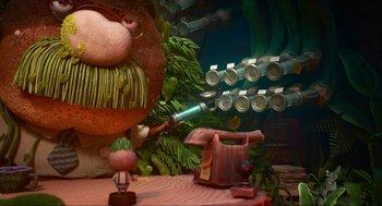 Movie still from “Elemental” (2023), directed by Peter Sohn – An image of an animated scene of a man with a pipe in his mouth; Wide shot, Over the shoulder angle
