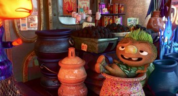 Movie still from “Elemental” (2023), directed by Peter Sohn – A display in a store filled with pots and pans; Wide shot, High angle