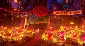 Movie still from “Elemental” (2023), directed by Peter Sohn – A large group of tables and chairs in front of a building; Extreme Wide shot, High angle