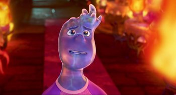 Movie still from “Elemental” (2023), directed by Peter Sohn – A purple character with a sad look on his face; Close Up shot, Over the shoulder angle