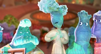 Movie still from “Elemental” (2023), directed by Peter Sohn – A group of glass figurines of a woman and a man; Close Up shot, Low angle