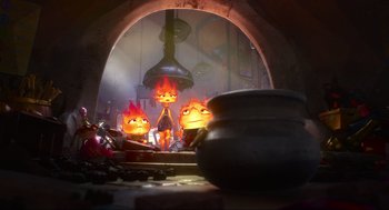 Movie still from “Elemental” (2023), directed by Peter Sohn – A group of people that are standing in a room; Wide shot, Low angle