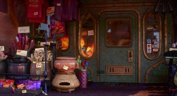 Movie still from “Elemental” (2023), directed by Peter Sohn – A room filled with furniture and a fire place; Wide shot, High angle