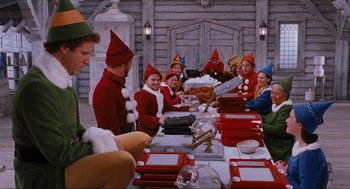 Movie still from “Elf” (2003), directed by Jon Favreau – A group of people sitting around a table; Wide shot, High angle