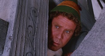 Movie still from “Elf” (2003), directed by Jon Favreau – A person wearing a hat; Close Up shot, Low angle