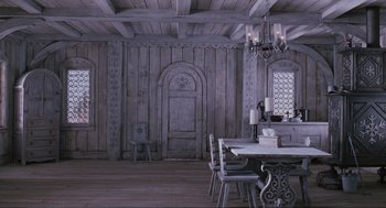 Movie still from “Elf” (2003), directed by Jon Favreau – An empty dining room with a table and chairs; Wide shot, High angle