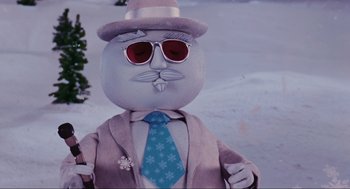 Movie still from “Elf” (2003), directed by Jon Favreau – A stuffed animal wearing a suit and tie; Close Up shot, Low angle