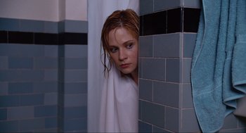Movie still from “Elf” (2003), directed by Jon Favreau – A young woman in a white towel in a bathroom; Close Up shot, Low angle