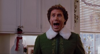 Movie still from “Elf” (2003), directed by Jon Favreau – A person wearing a costume; Close Up shot, Low angle