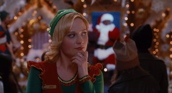 Movie still from “Elf” (2003), directed by Jon Favreau – A woman wearing a green and red elf outfit; Close Up shot, Over the shoulder angle