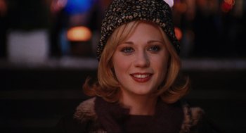Movie still from “Elf” (2003), directed by Jon Favreau – A person wearing a hat; Close Up shot, Over the shoulder angle