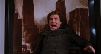 Movie still from “Elf” (2003), directed by Jon Favreau – An image of will ferrell in the movie anchorman; Medium shot, Low angle