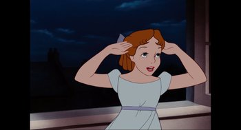 Movie still from “Elizabeth: A Portrait in Part(s)” (2022), directed by Roger Michell – A woman in a white dress holding her hands to her head; Close Up shot, High angle