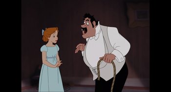 Movie still from “Elizabeth: A Portrait in Part(s)” (2022), directed by Roger Michell – A man and a little girl are standing next to each other; Medium shot, Over the shoulder angle
