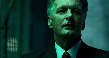 Movie still from “A Good Day to Die Hard” (2013), directed by John Moore – A person wearing a suit and tie; Close Up shot, Low angle