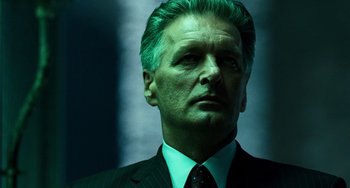 Movie still from “A Good Day to Die Hard” (2013), directed by John Moore – A person wearing a suit and tie; Close Up shot, Low angle