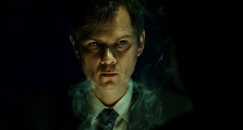 Movie still from “A Good Day to Die Hard” (2013), directed by John Moore – A person wearing a suit and tie; Close Up shot, Low angle