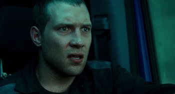 Movie still from “A Good Day to Die Hard” (2013), directed by John Moore – A person in a black shirt; Close Up shot, Low angle