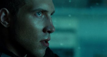 Movie still from “A Good Day to Die Hard” (2013), directed by John Moore – A man's face in the dark; Close Up shot, Low angle