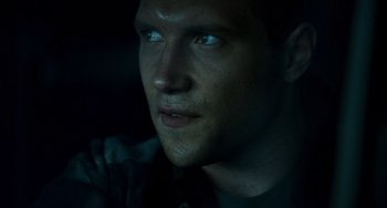 Movie still from “A Good Day to Die Hard” (2013), directed by John Moore – A man's face in the dark; Close Up shot, Low angle