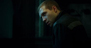 Movie still from “A Good Day to Die Hard” (2013), directed by John Moore – A person wearing a black shirt; Close Up shot, Low angle