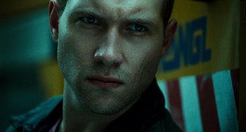 Movie still from “A Good Day to Die Hard” (2013), directed by John Moore – A man's face in front of a wall; Close Up shot, Low angle
