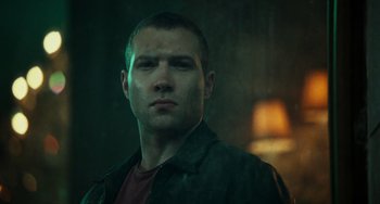 Movie still from “A Good Day to Die Hard” (2013), directed by John Moore – A person wearing a shirt and jacket; Close Up shot, Low angle