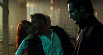 Movie still from “A Good Day to Die Hard” (2013), directed by John Moore – A group of people standing next to each other in a room; Medium shot, Low angle