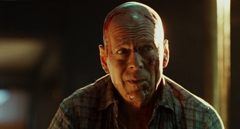 Movie still from “A Good Day to Die Hard” (2013), directed by John Moore – A bald man with blood all over his face; Close Up shot, Low angle