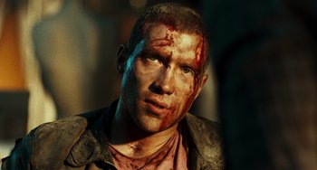 Movie still from “A Good Day to Die Hard” (2013), directed by John Moore – A person with blood all over his face; Close Up shot, Low angle