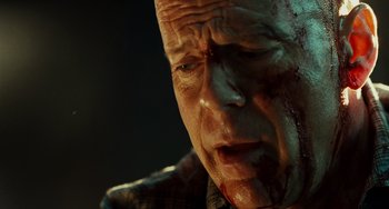Movie still from “A Good Day to Die Hard” (2013), directed by John Moore – A person with blood all over his face; Close Up shot, Low angle