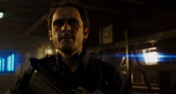 Movie still from “A Good Day to Die Hard” (2013), directed by John Moore – A person holding a gun; Close Up shot, Low angle