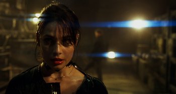 Movie still from “A Good Day to Die Hard” (2013), directed by John Moore – A woman with a red lipstick standing in the dark; Close Up shot, Over the shoulder angle