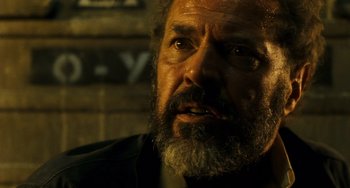 Movie still from “A Good Day to Die Hard” (2013), directed by John Moore – A person with a beard; Close Up shot, Over the shoulder angle