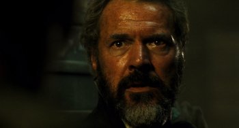 Movie still from “A Good Day to Die Hard” (2013), directed by John Moore – A person with a beard; Close Up shot, Low angle