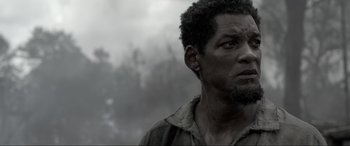Movie still from “Emancipation” (2022), directed by Antoine Fuqua – A person with a beard; Close Up shot, Low angle