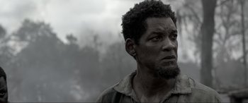 Movie still from “Emancipation” (2022), directed by Antoine Fuqua – A person with a beard; Close Up shot, Low angle