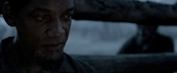 Movie still from “Emancipation” (2022), directed by Antoine Fuqua – A man's face in the dark; Close Up shot, Over the shoulder angle