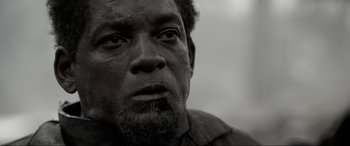 Movie still from “Emancipation” (2022), directed by Antoine Fuqua – A man's face in black - and - white; Close Up shot, Low angle