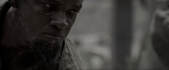 Movie still from “Emancipation” (2022), directed by Antoine Fuqua – A person with a beard; Close Up shot, Over the shoulder angle