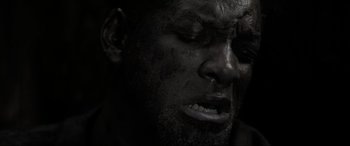 Movie still from “Emancipation” (2022), directed by Antoine Fuqua – A man's face in black and white; Extreme Close Up shot, Overhead angle