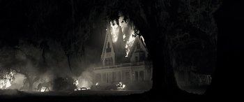 Movie still from “Emancipation” (2022), directed by Antoine Fuqua – A house on fire in the middle of the night; Extreme Wide shot, Low angle