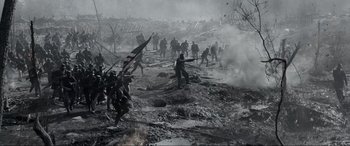 Movie still from “Emancipation” (2022), directed by Antoine Fuqua – A group of people in the middle of a field; Extreme Wide shot, Low angle